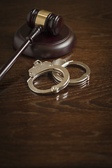 Image showing Gavel and Pair of Handcuffs on Table