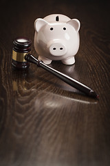 Image showing Gavel and Piggy Bank on Table