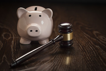 Image showing Gavel and Piggy Bank on Table