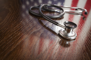 Image showing Stethoscope with American Flag Reflection on Table