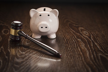 Image showing Gavel and Piggy Bank on Table