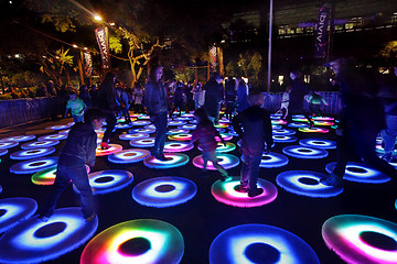 Image showing Participants interact with Vivid Sydney The Pool interactive cir