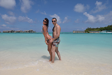 Image showing happy young couple have fun on beach