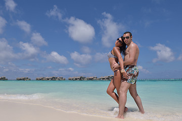 Image showing happy young couple have fun on beach