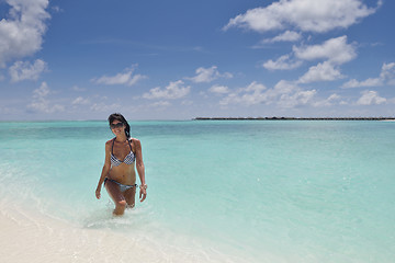 Image showing beautiful young woman  on beach have fun and relax