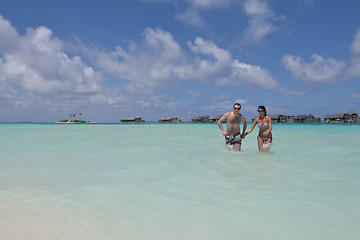 Image showing happy young couple have fun on beach