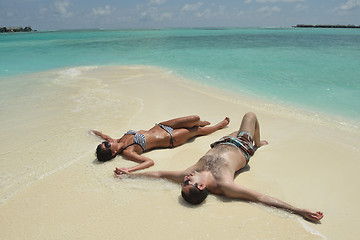 Image showing happy young couple have fun on beach