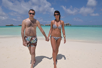 Image showing happy young couple have fun on beach