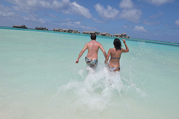 Image showing happy young couple have fun on beach