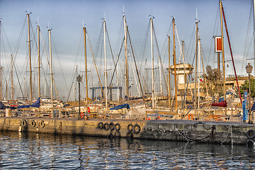 Image showing Sailing and engine boats in the harbour channel