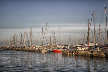 Image showing Sailing and engine boats in the harbour channel