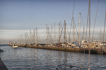 Image showing Sailing and engine boats in the harbour channel