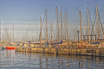 Image showing Sailing and engine boats in the harbour channel