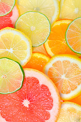 Image showing Sliced citrus fruits background
