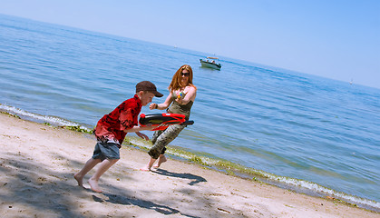 Image showing Mother and Son playing at the beach
