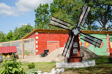 Image showing colorful country yard mill in summer time 