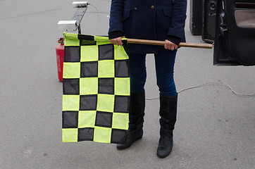 Image showing hand hold checkered rally racing start flag 