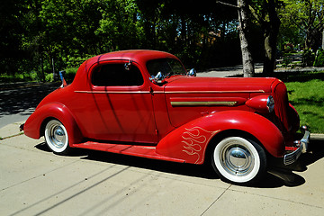 Image showing Vintage red car.