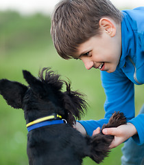 Image showing Little boy and his dog