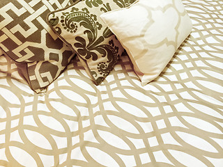 Image showing Decorative cushions on a bed