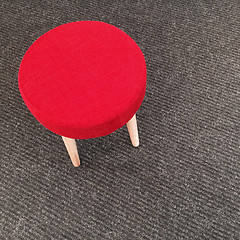 Image showing Red stool on gray carpet floor