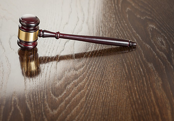 Image showing Wooden Gavel Abstract on Reflective Table