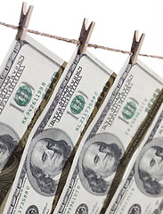 Image showing Hundred Dollar Bills Hanging From Clothesline on White