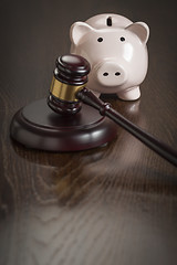 Image showing Gavel and Piggy Bank on Table