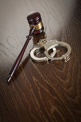 Image showing Gavel and Pair of Handcuffs on Table