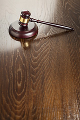 Image showing Wooden Gavel Abstract on Reflective Table