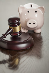 Image showing Gavel and Piggy Bank on Table