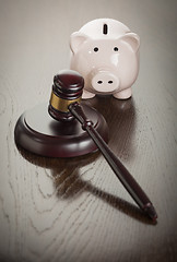 Image showing Gavel and Piggy Bank on Table