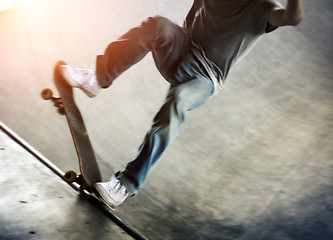 Image showing Skateboarder doing a trick