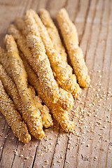 Image showing bread sticks grissini with sesame seeds