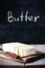 Image showing fresh butter and blackboard