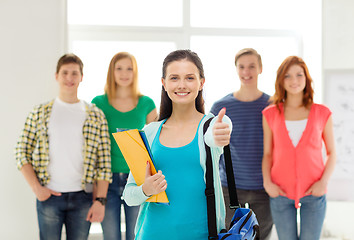 Image showing smiling students with teenage girl in front