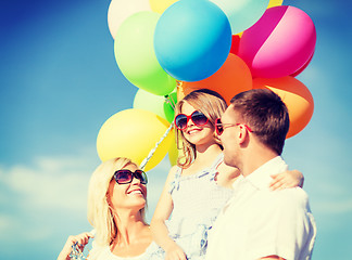 Image showing family with colorful balloons