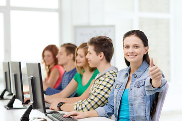 Image showing female student with classmates in computer class