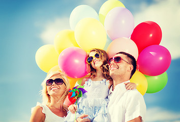 Image showing family with colorful balloons