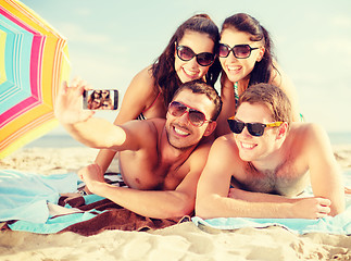 Image showing group of people taking picture with smartphone