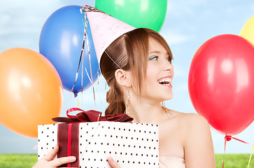 Image showing party girl with balloons and gift box