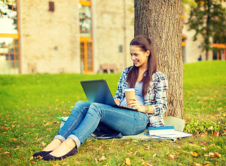 Image showing teenager in eyeglasses with laptop and coffee