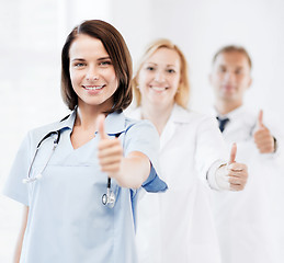 Image showing team of doctors showing thumbs up