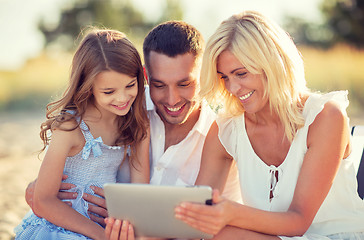 Image showing happy family with tablet pc taking picture