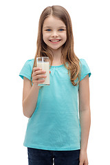 Image showing smiling little girl with glass of milk