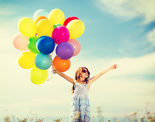 Image showing happy girl with colorful balloons