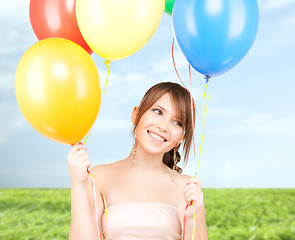 Image showing happy teenage girl with balloons