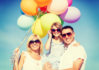 Image showing family with colorful balloons