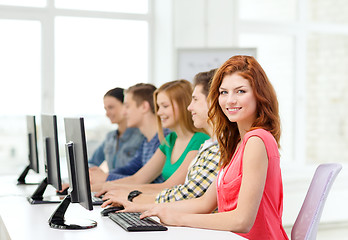 Image showing female student with classmates in computer class