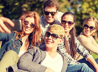 Image showing teenagers taking photo with smartphone outside